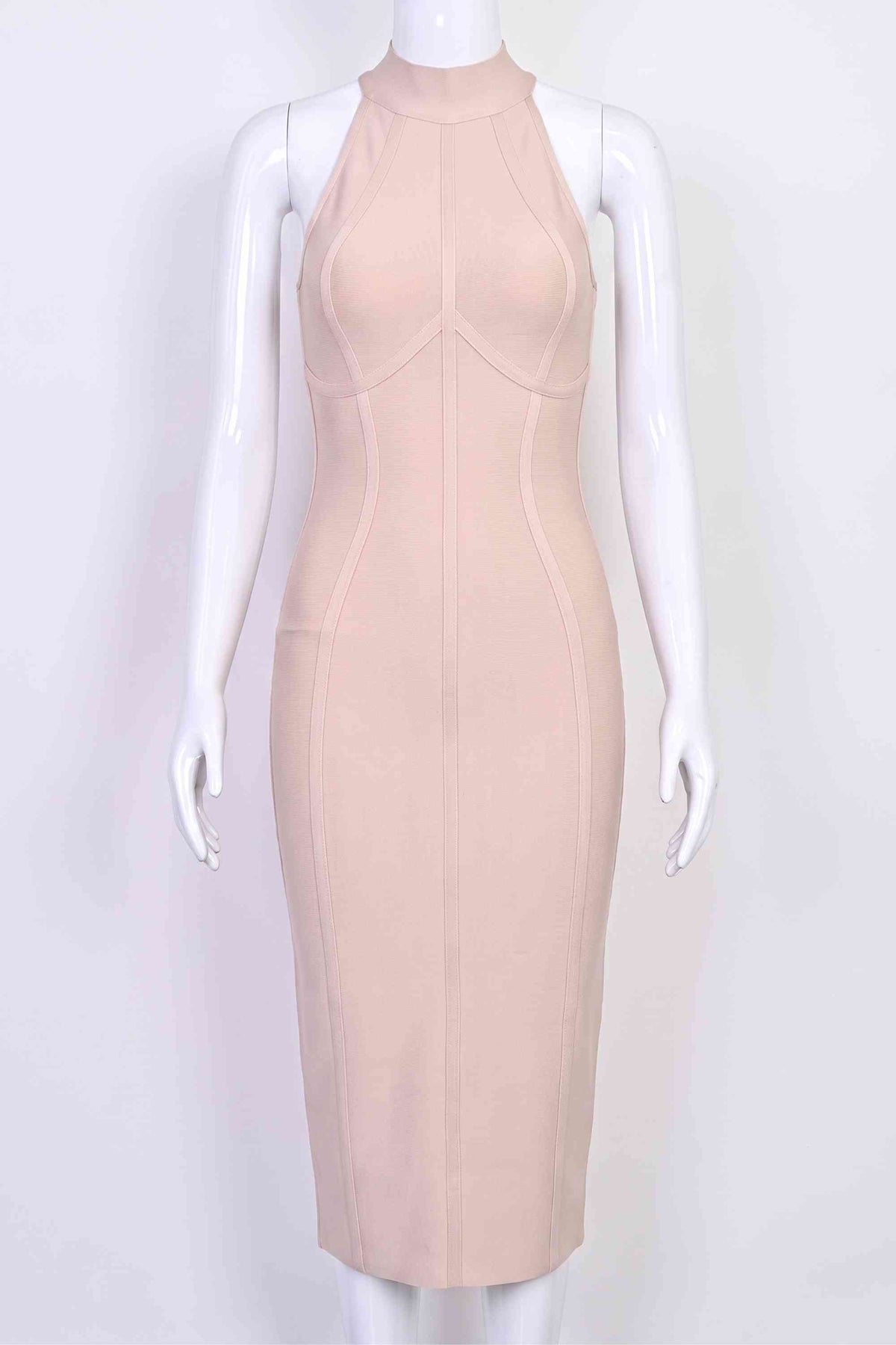 Woman wearing a figure flattering Lea Bandage Midi Dress - Beige Bodycon Collection