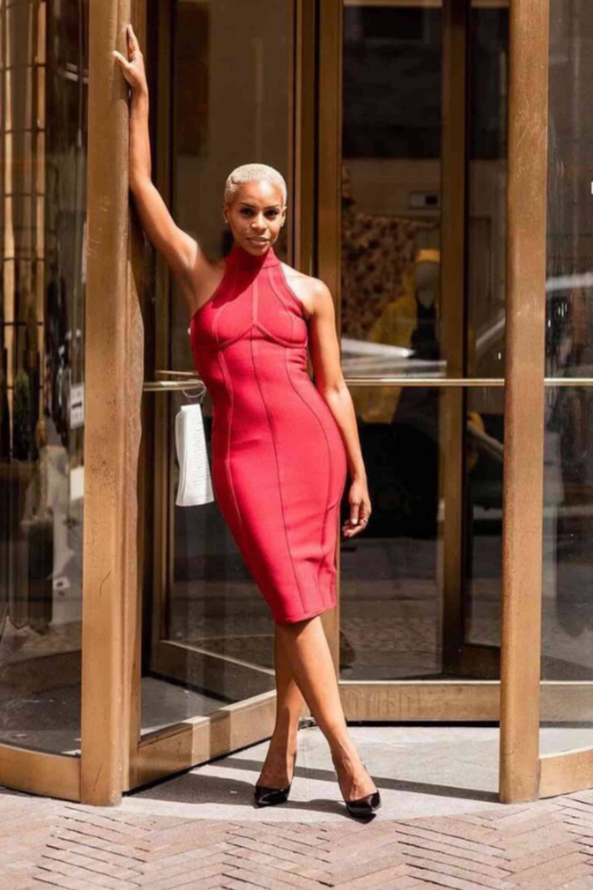 Woman wearing a figure flattering Lea Bandage Midi Dress - White Pearl Bodycon Collection