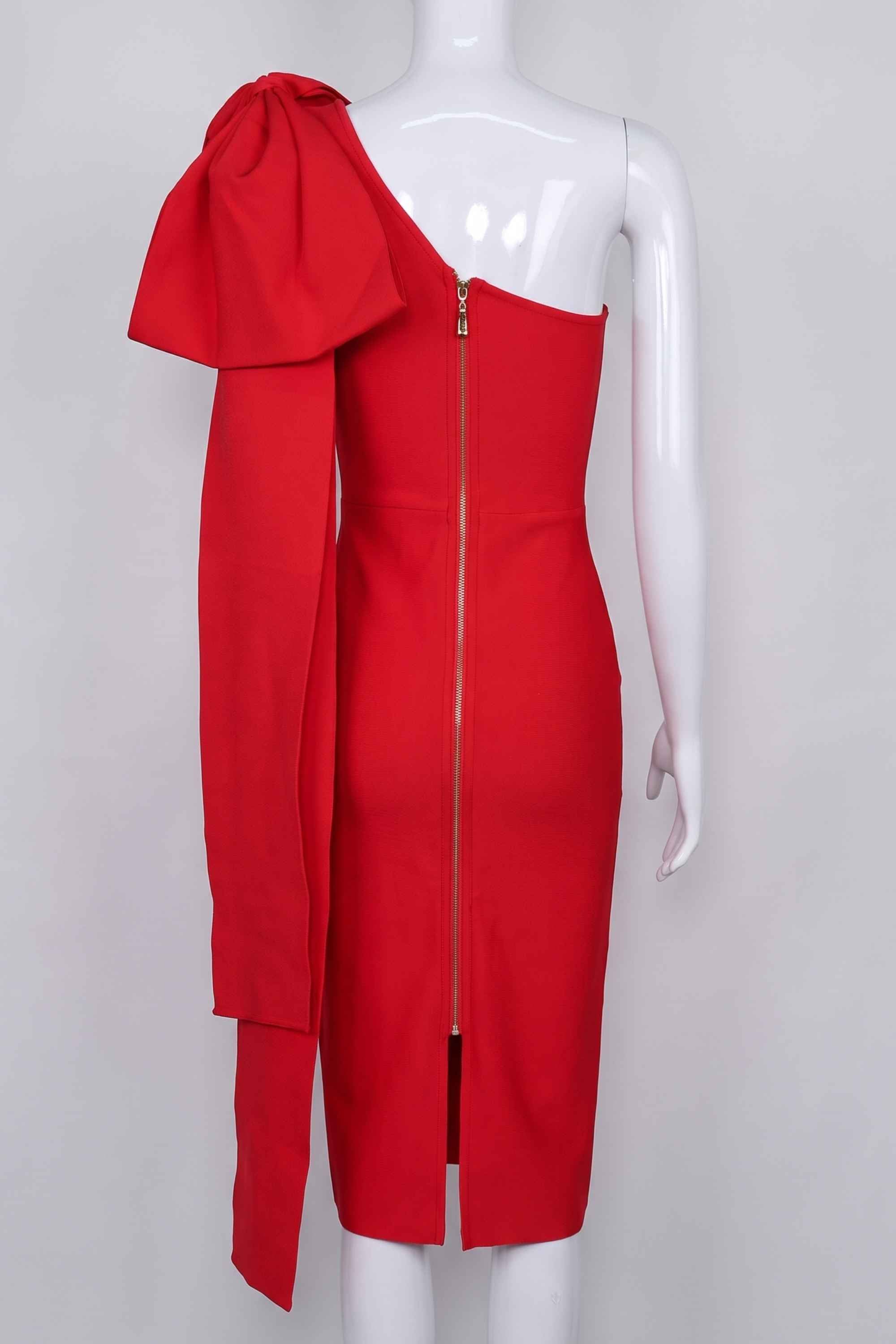 Woman wearing a figure flattering Lela Long Sleeve Bandage Midi Dress - Lipstick Red BODYCON COLLECTION
