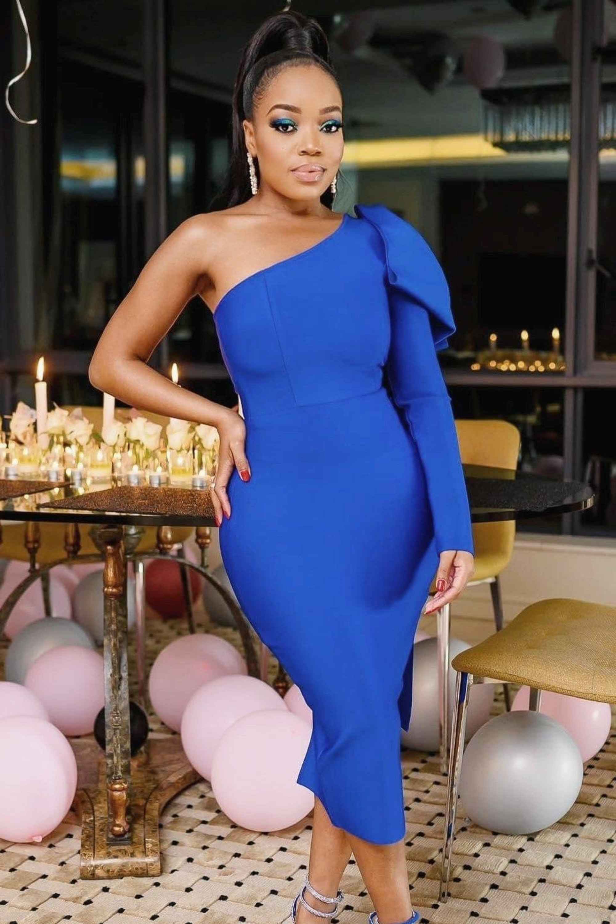 Woman wearing a figure flattering Lela Long Sleeve Bandage Midi Dress - Royal Blue BODYCON COLLECTION