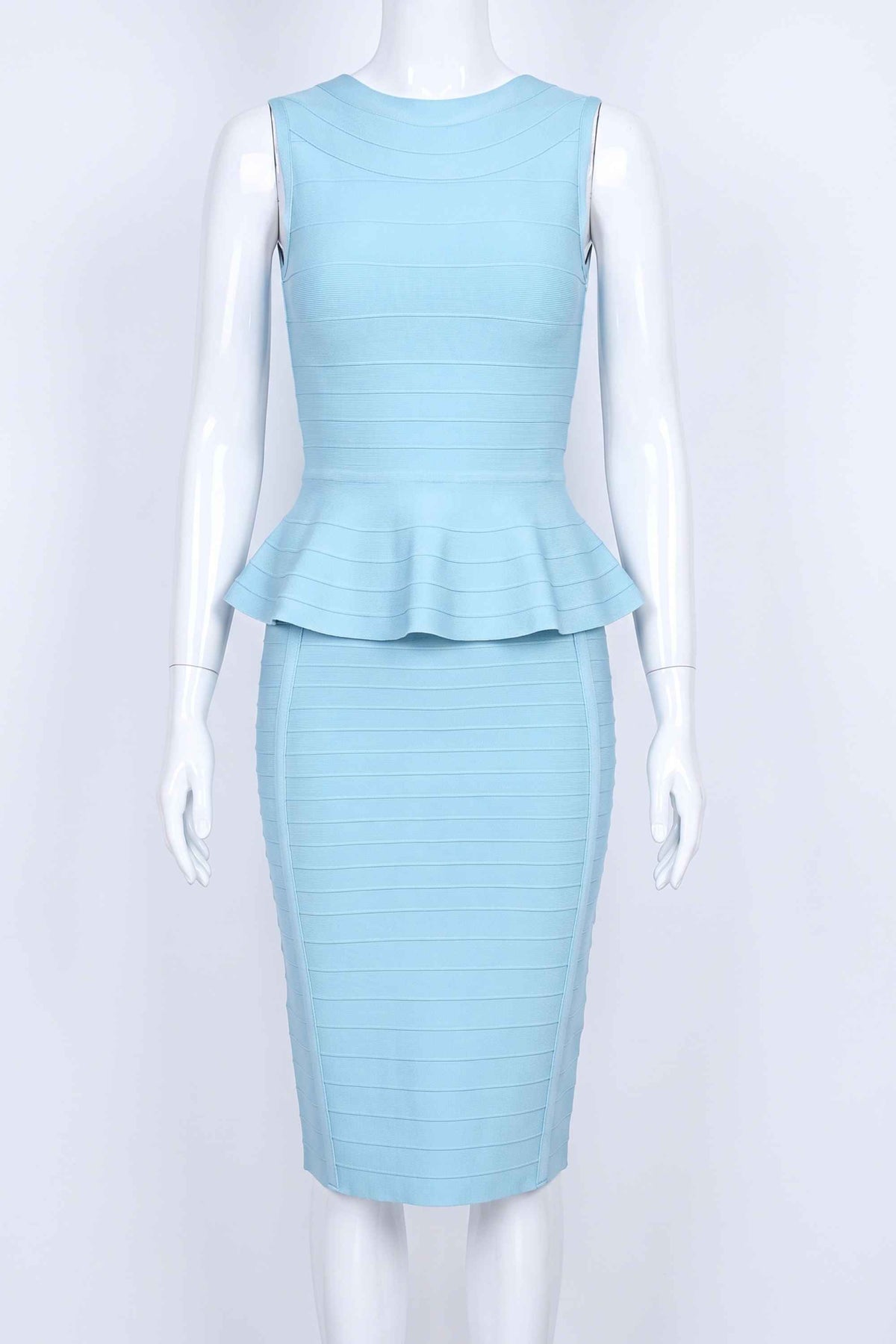 Woman wearing a figure flattering Leni Bandage Top - Sky Blue BODYCON COLLECTION