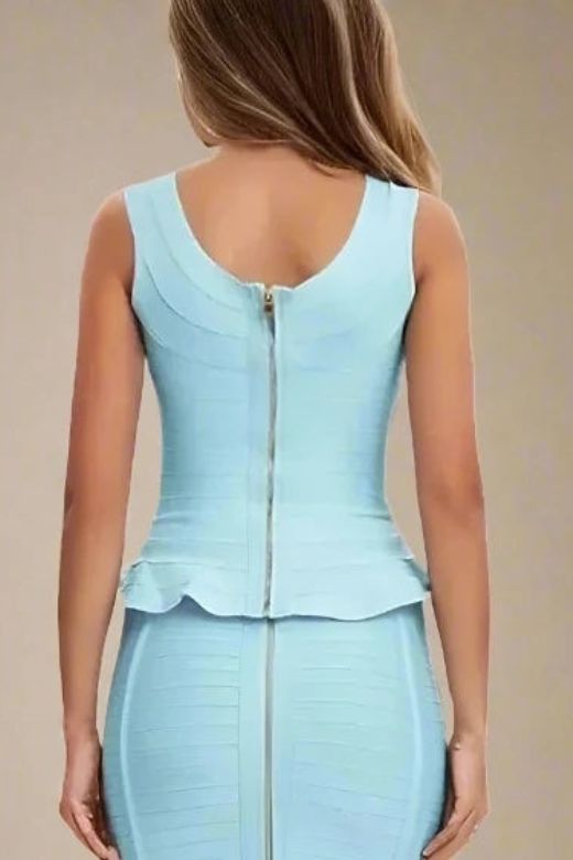 Woman wearing a figure flattering Leni Bandage Top - Sky Blue BODYCON COLLECTION