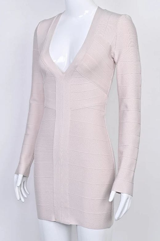 Woman wearing a figure flattering Lisa Long Sleeve Bandage Mini Dress - Cream BODYCON COLLECTION Pty Ltd