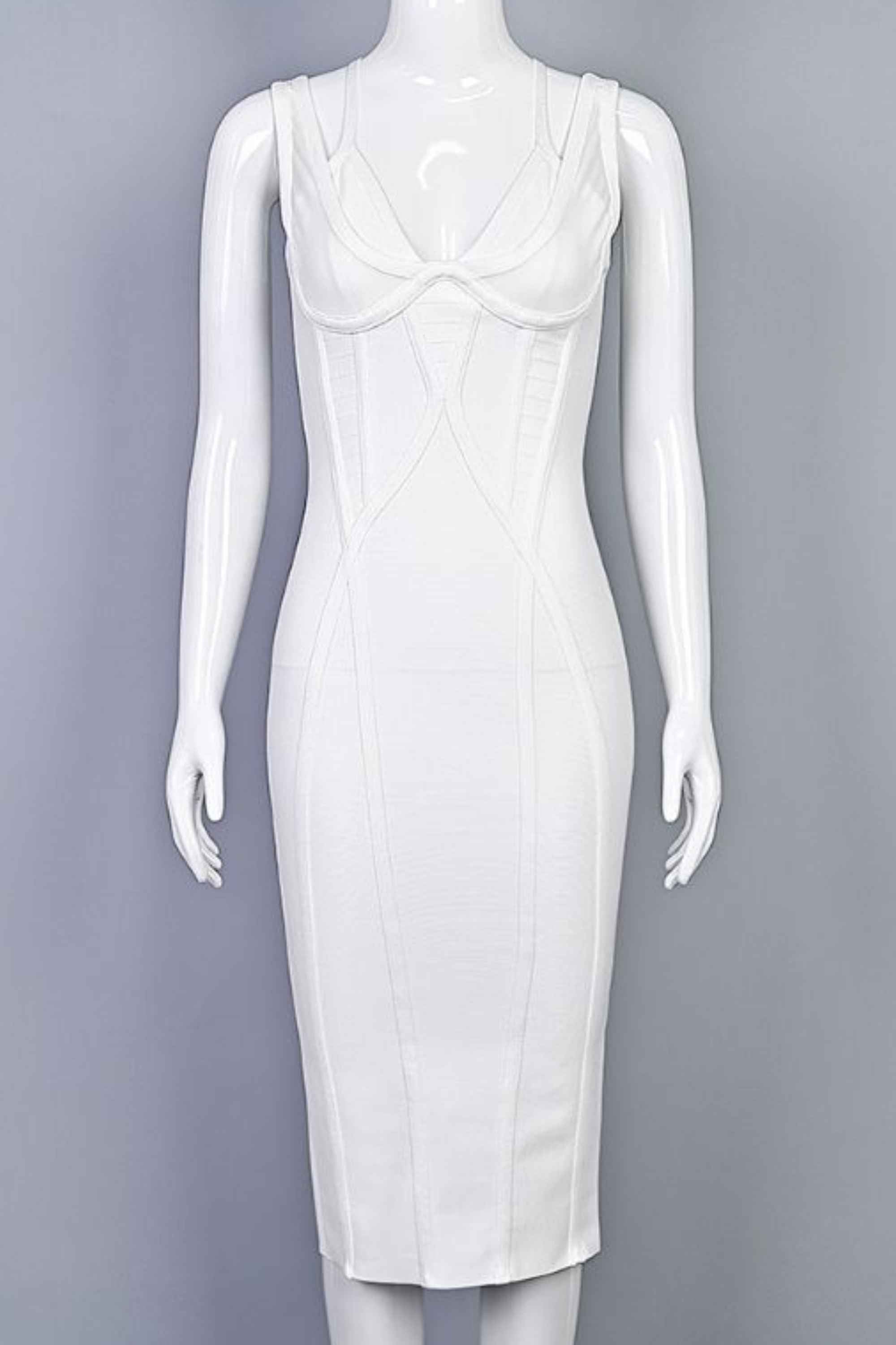Woman wearing a figure flattering Lucy Bandage Midi Dress - White Pearl BODYCON COLLECTION
