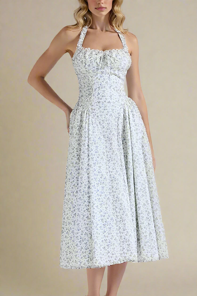 Woman wearing a figure flattering Lynsie Bodycon Midi Dress - Blue Floral BODYCON COLLECTION