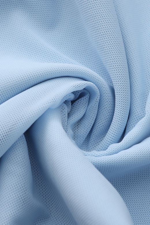 Woman wearing a figure flattering Margot Wrap Top and Maxi Skirt Outfit Set - Sky Blue BODYCON COLLECTION