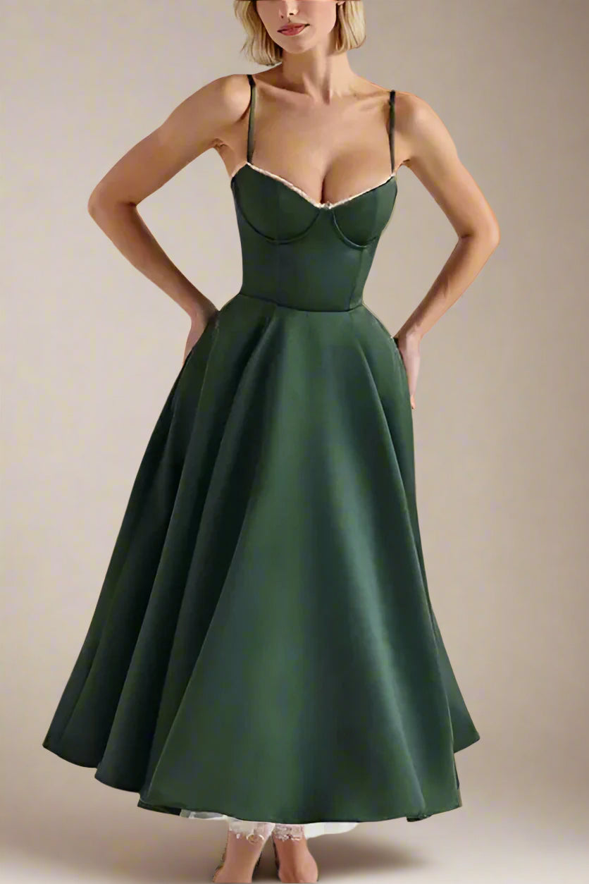 Woman wearing a figure flattering Mavis Bodycon Midi Dress - Emerald Green BODYCON COLLECTION