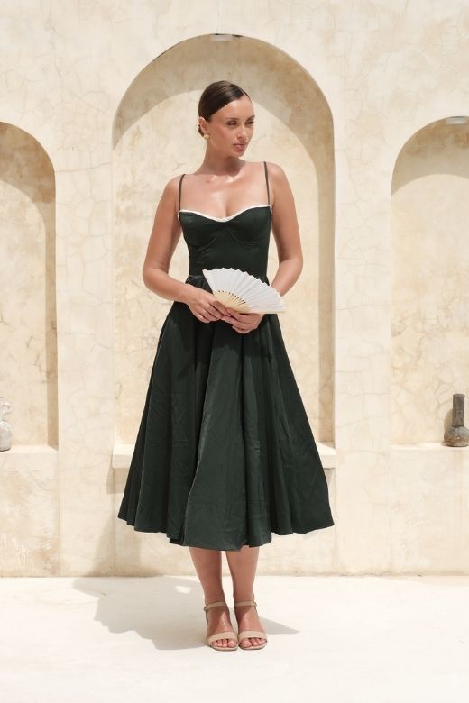Woman wearing a figure flattering Mavis Midi Dress - Classic Black BODYCON COLLECTION