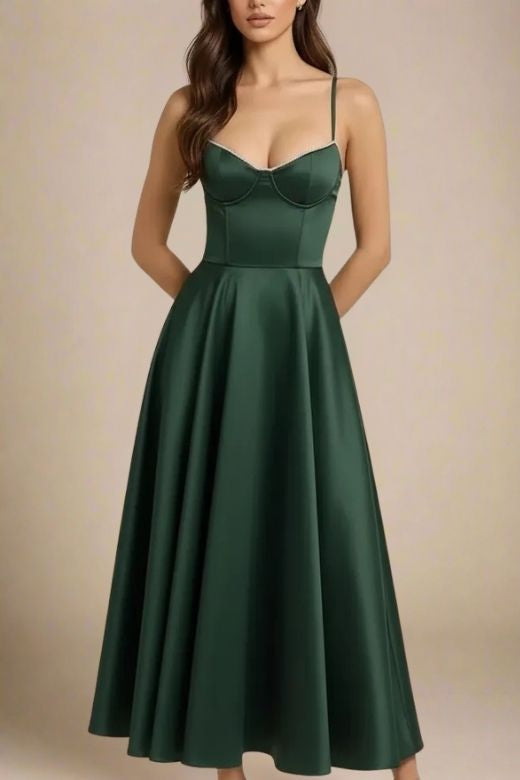 Woman wearing a figure flattering Mavis Midi Dress - Emerald Green BODYCON COLLECTION
