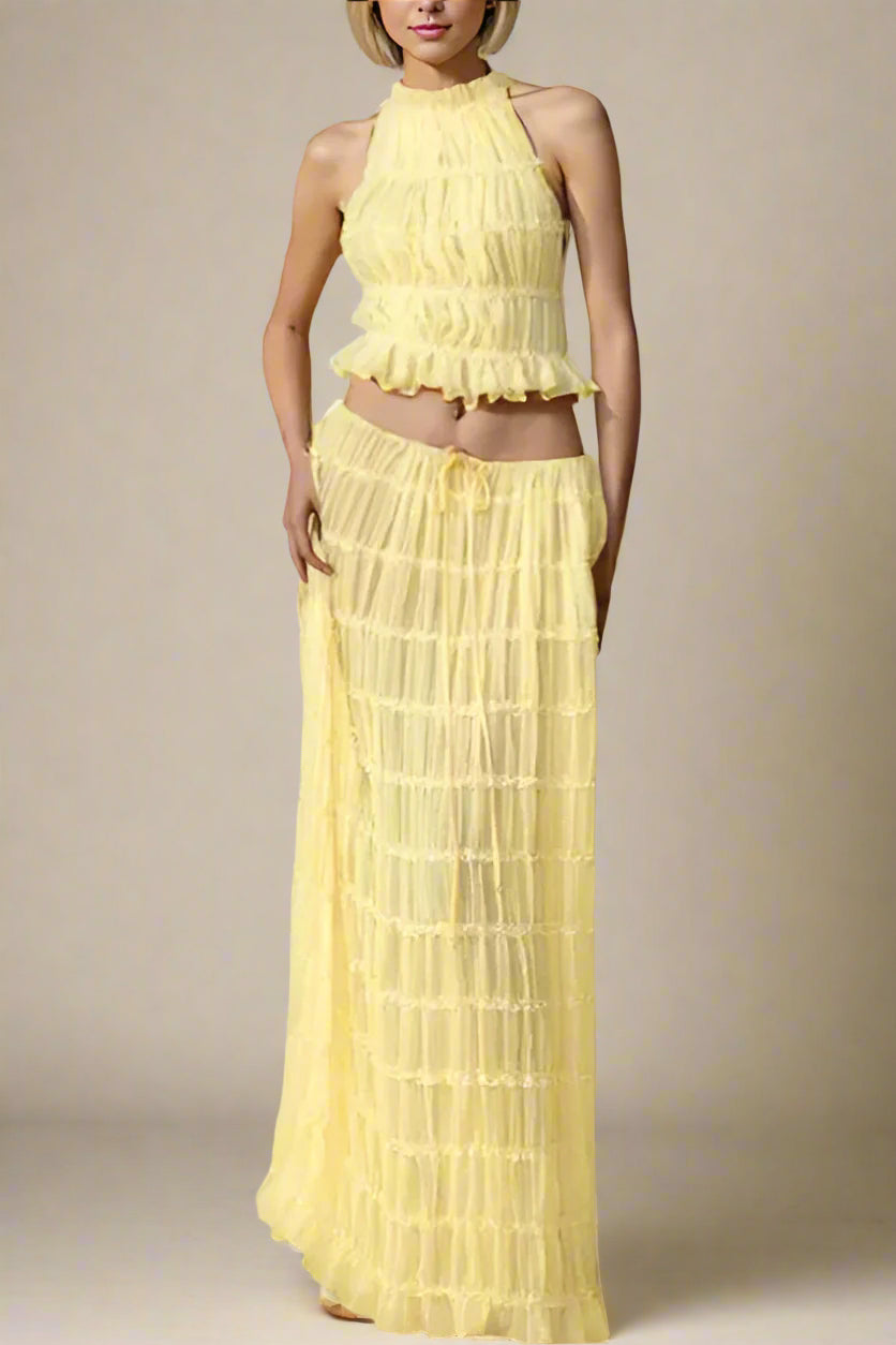Woman wearing a figure flattering Meryl Wrap Top and Maxi Skirt Set - Butter Yellow BODYCON COLLECTION