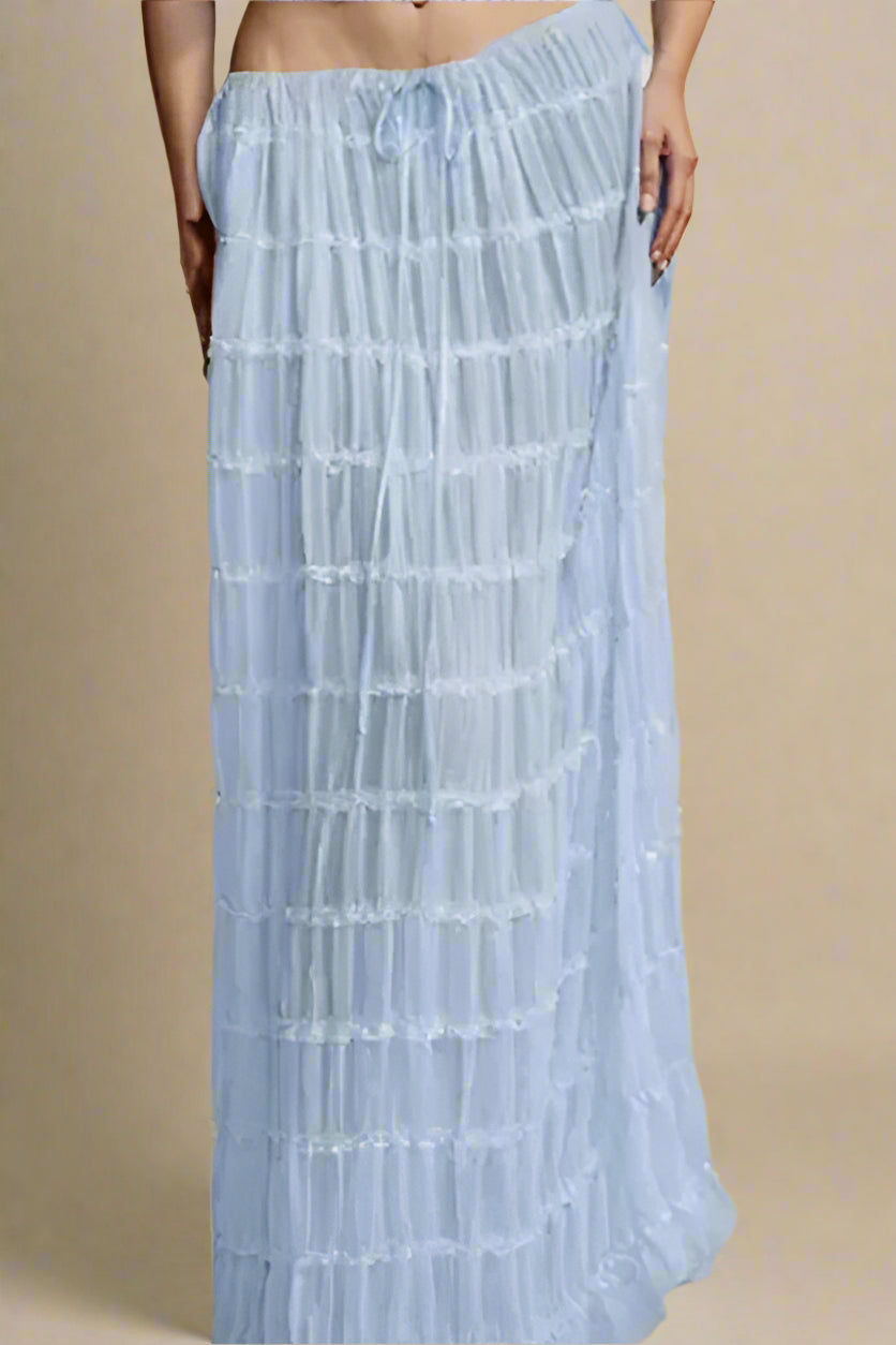 Woman wearing a figure flattering Meryl Wrap Top and Maxi Skirt Set - Sky Blue BODYCON COLLECTION