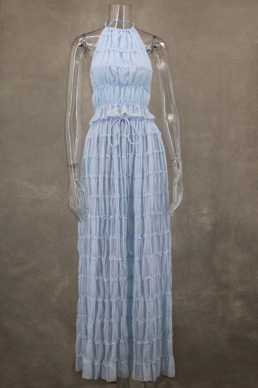 Woman wearing a figure flattering Meryl Wrap Top and Maxi Skirt Set - Sky Blue BODYCON COLLECTION