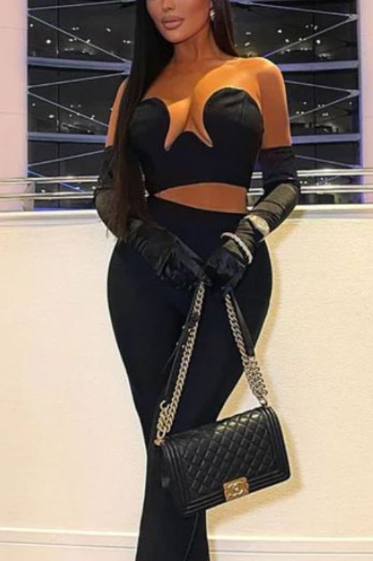Woman wearing a figure flattering Mika Bandage Crop Top - Classic Black BODYCON COLLECTION
