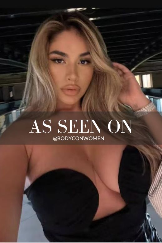 Woman wearing a figure flattering Mika Bandage Crop Top - Classic Black BODYCON COLLECTION