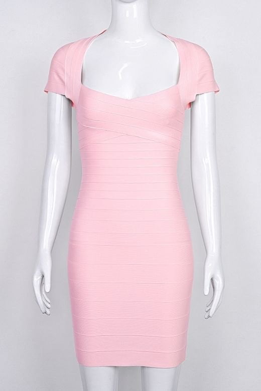 Woman wearing a figure flattering  Miranda Bandage Mini Dress - Dusty Pink Bodycon Collection