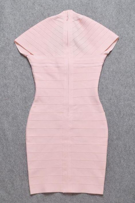 Woman wearing a figure flattering Miranda Bandage Mini Dress - Dusty Pink Bodycon Collection