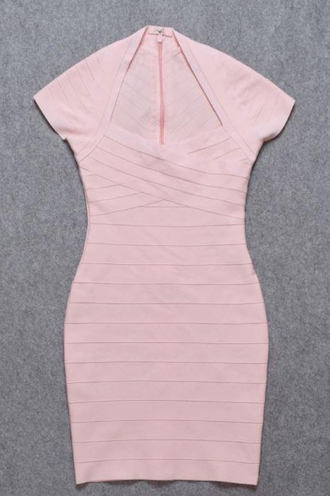 Woman wearing a figure flattering Miranda Bandage Mini Dress - Dusty Pink Bodycon Collection