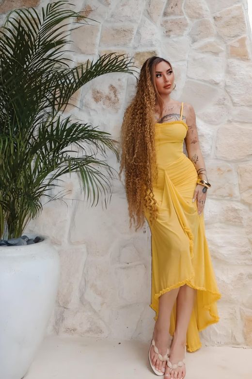 Woman wearing a figure flattering  Noah Bodycon Wrap Midi Dress- Sun Yellow BODYCON COLLECTION
