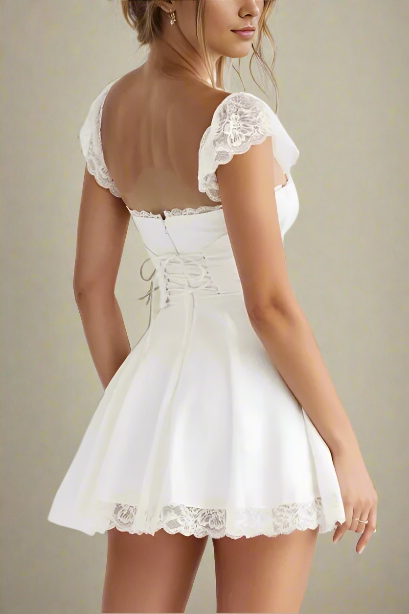 Woman wearing a figure flattering Nori Bodycon Mini Dress - Pearl White BODYCON COLLECTION