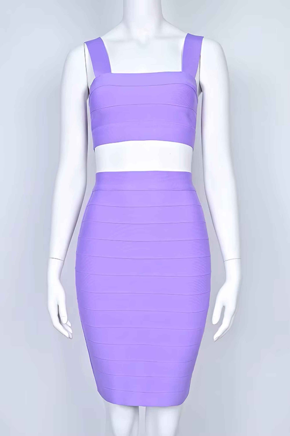 Woman wearing a figure flattering Ophelia Bandage Crop Top and Skirt Set - Violet BODYCON COLLECTION Pty Ltd
