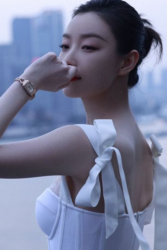 Woman wearing a figure flattering Payton Bandage Dress - Dusty Pink BODYCON COLLECTION