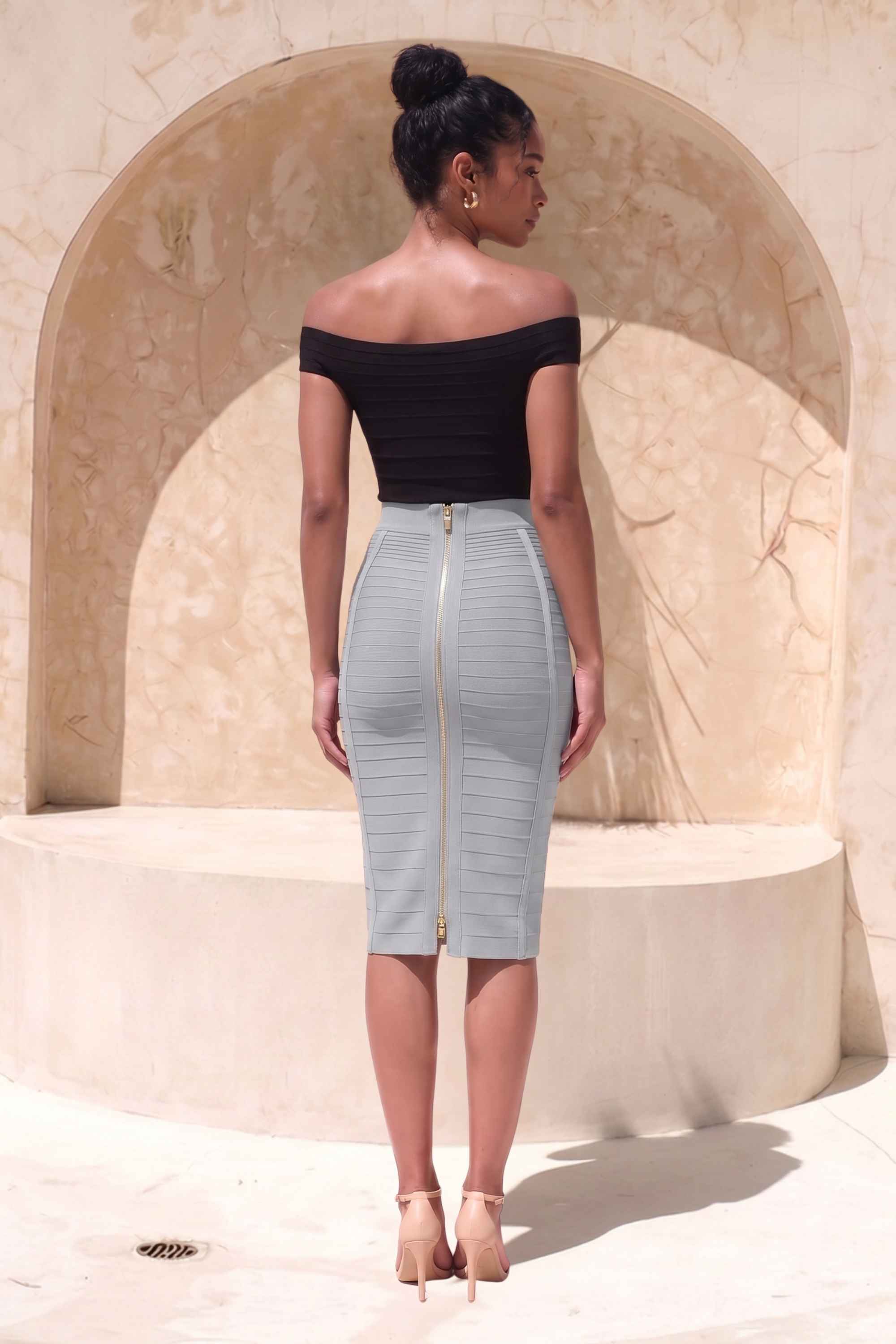 Woman wearing a figure flattering Pencil High Waist Bandage Knee Length Knitted Skirt - Steel Grey BODYCON COLLECTION