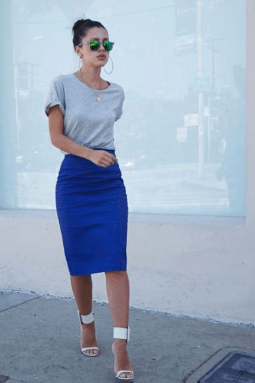 Woman wearing a figure flattering Pencil High Waist Bandage Knee Length Skirt - Navy Blue BODYCON COLLECTION
