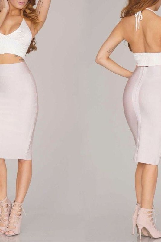 Woman wearing a figure flattering Pencil High Waist Bandage Knee Length Skirt - Plum Purple BODYCON COLLECTION
