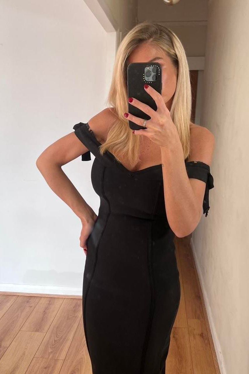Woman wearing a figure flattering Penelope Bandage Mini Dress - Lipstick Red BODYCON COLLECTION