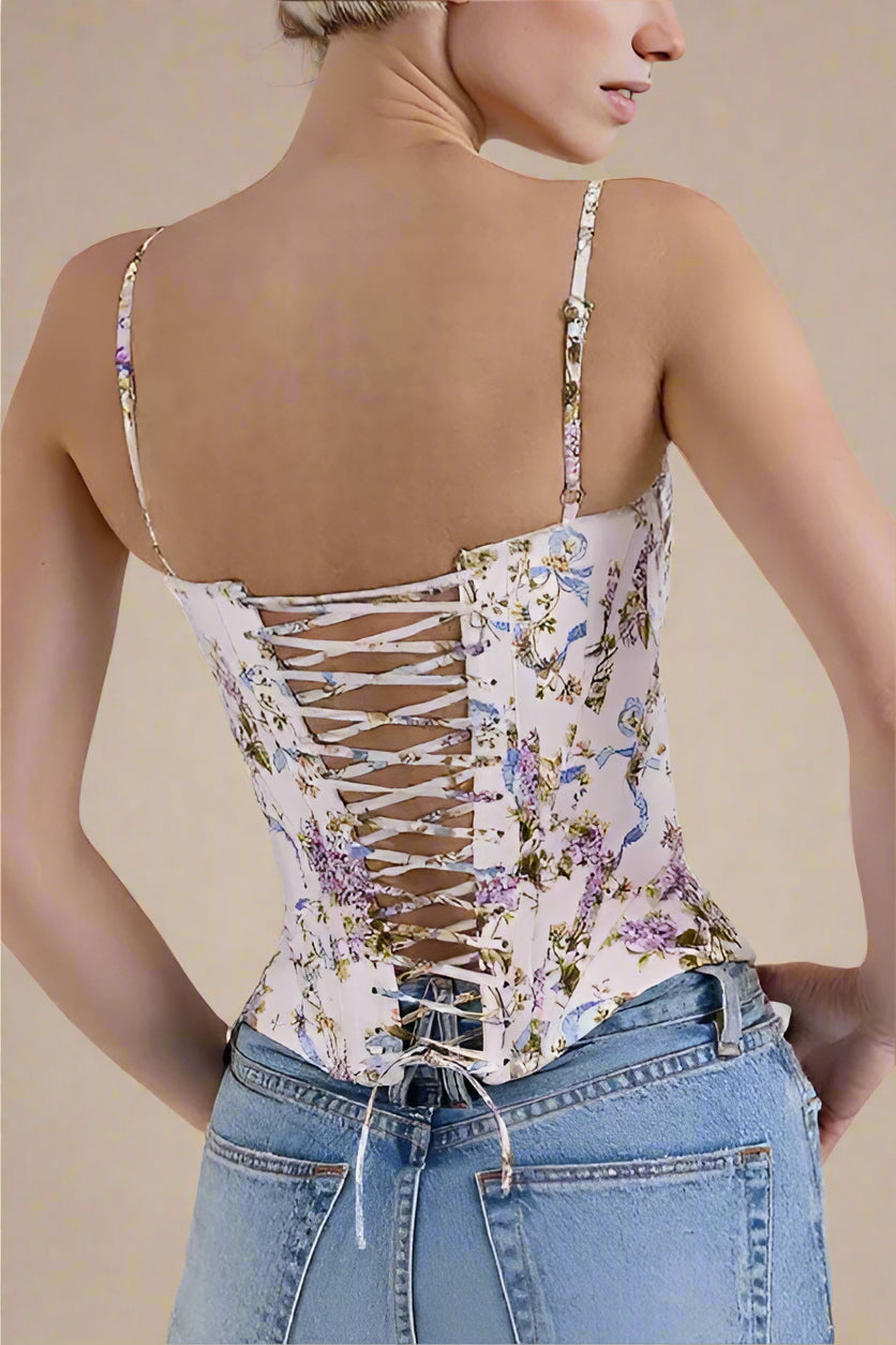 Woman wearing a figure flattering Penny Corset Top - White Floral BODYCON COLLECTION Pty Ltd