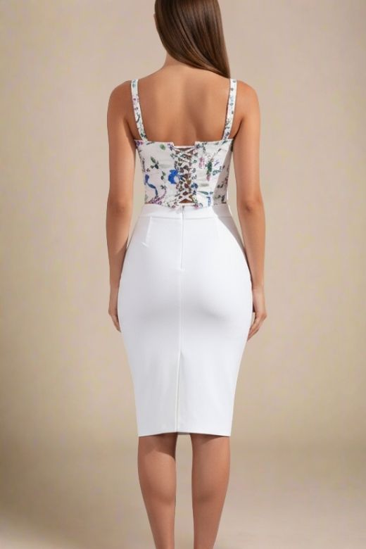 Woman wearing a figure flattering Penny Top - White Floral BODYCON COLLECTION Pty Ltd