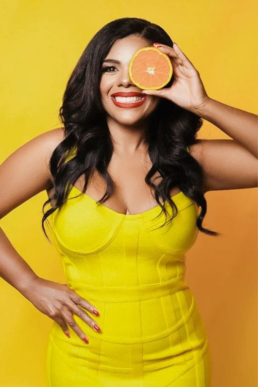 Woman wearing a figure flattering Pip Bandage Corset Dress - Sun Yellow Bodycon Collection