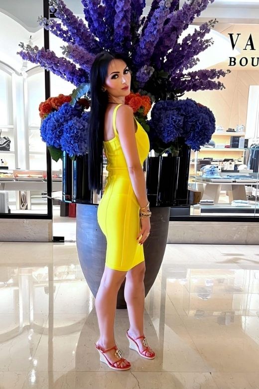 Woman wearing a figure flattering Pip Bandage Mini Dress - Sun Yellow BODYCON COLLECTION