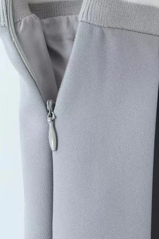 Woman wearing a figure flattering Pleated Sports Mini Skirt - Cloud Grey BODYCON COLLECTION Pty Ltd