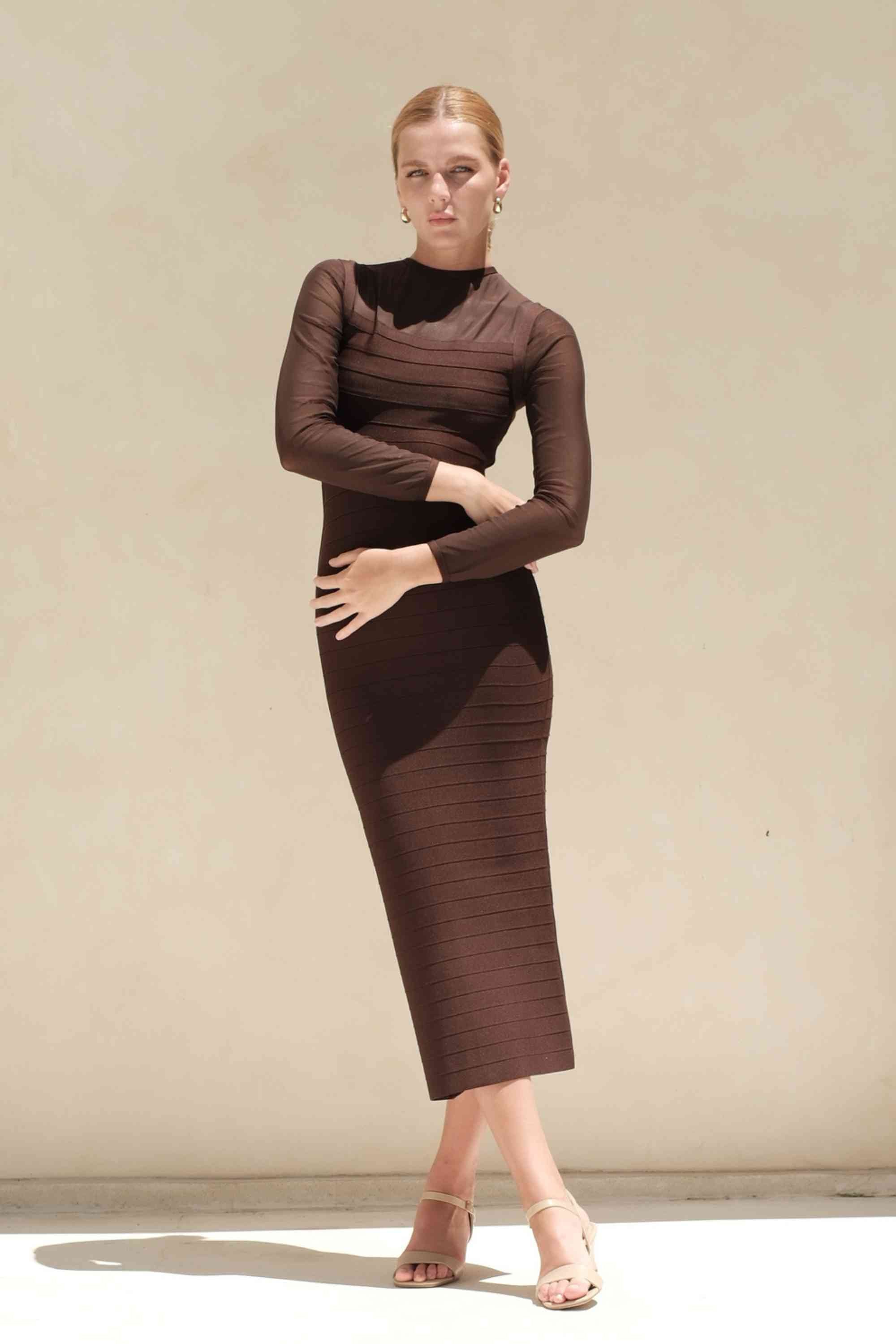 Woman wearing a figure flattering Robin Long Sleeve Bandage Maxi Dress - Tan Brown BODYCON COLLECTION Pty Ltd