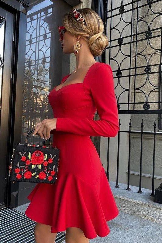 Woman wearing a figure flattering Sara Bodycon Long Sleeve Mini Dress - Lipstick Red BODYCON COLLECTION