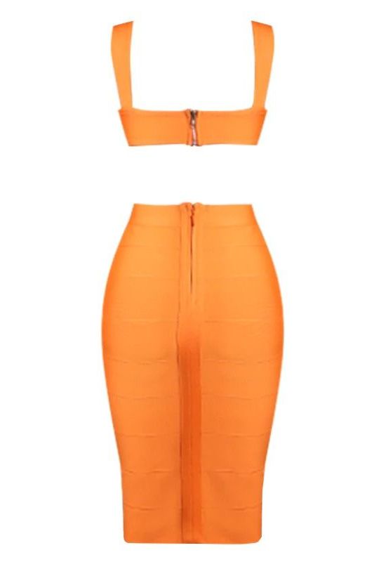 Woman wearing a figure flattering Sasha Bandage Midi Dress - Apricot Orange BODYCON COLLECTION