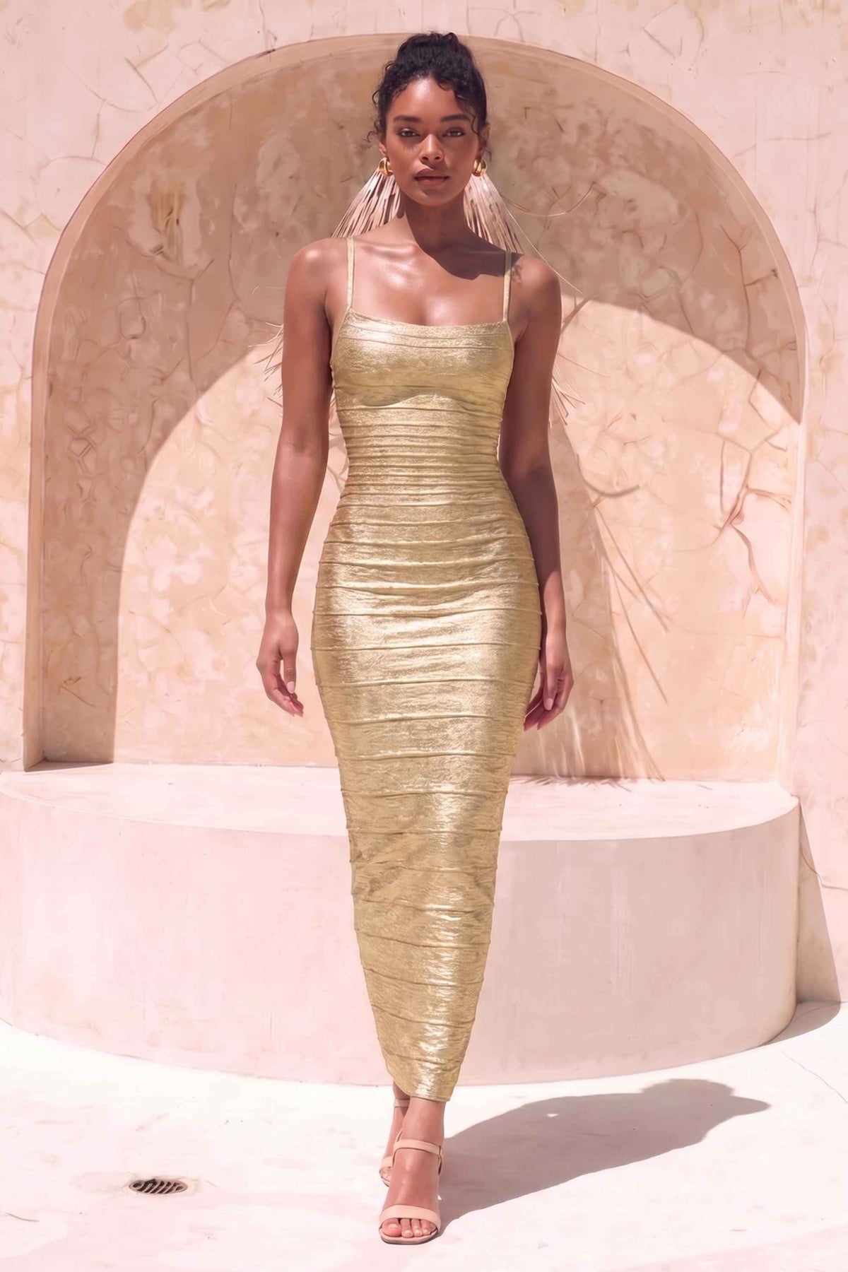 Woman wearing a figure flattering Scarlett Bandage Maxi Dress - Gold BODYCON COLLECTION Pty Ltd
