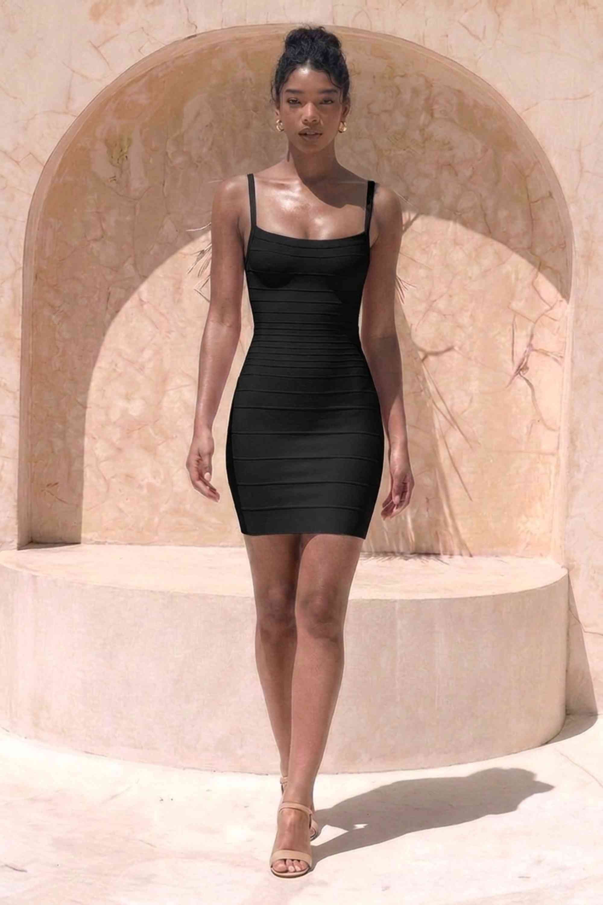 Woman wearing a figure flattering Scarlett Bandage Mini Dress - Classic Black BODYCON COLLECTION Pty Ltd