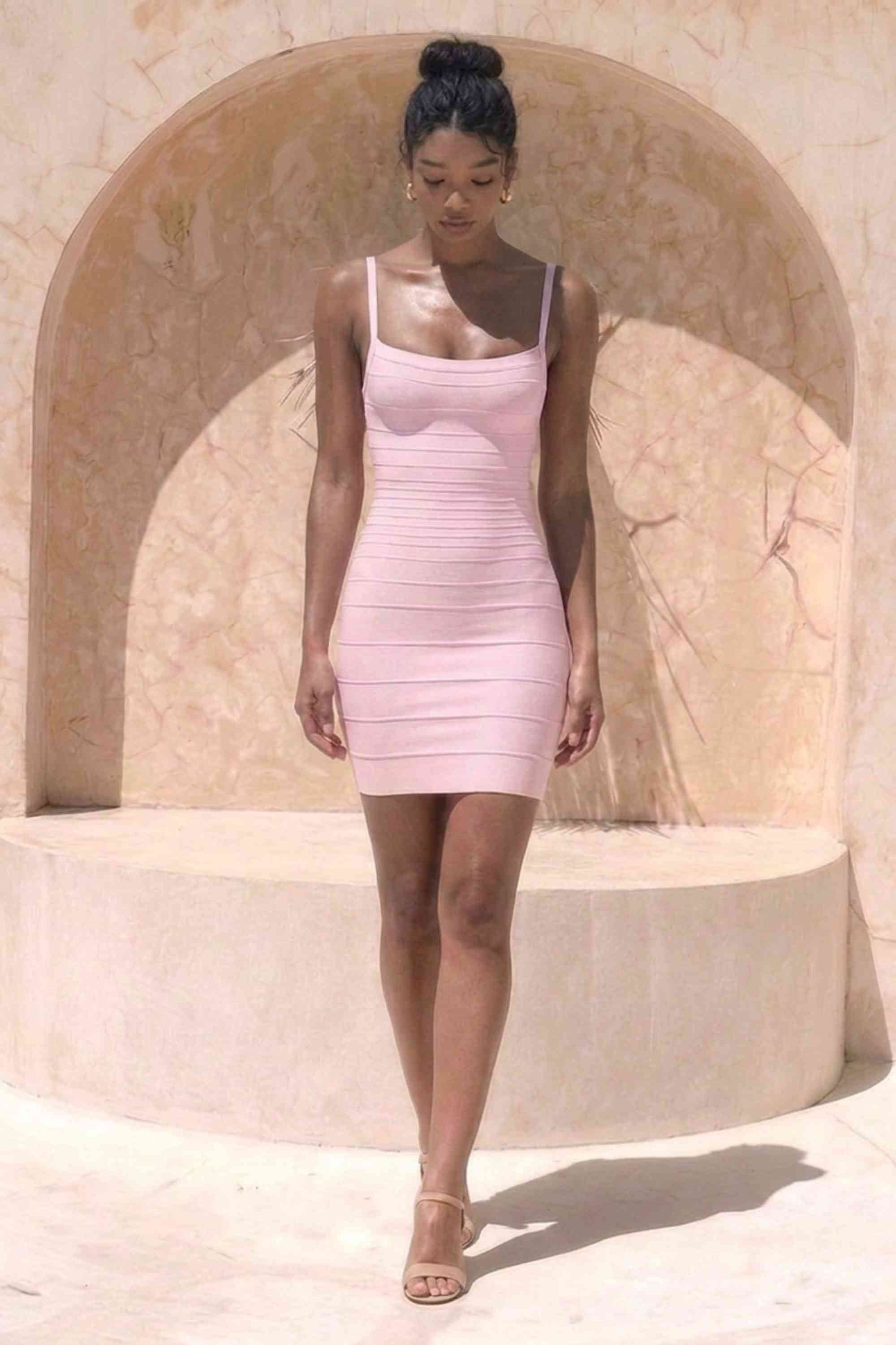 Woman wearing a figure flattering Scarlett Bandage Mini Dress - Dusty Pink BODYCON COLLECTION Pty Ltd