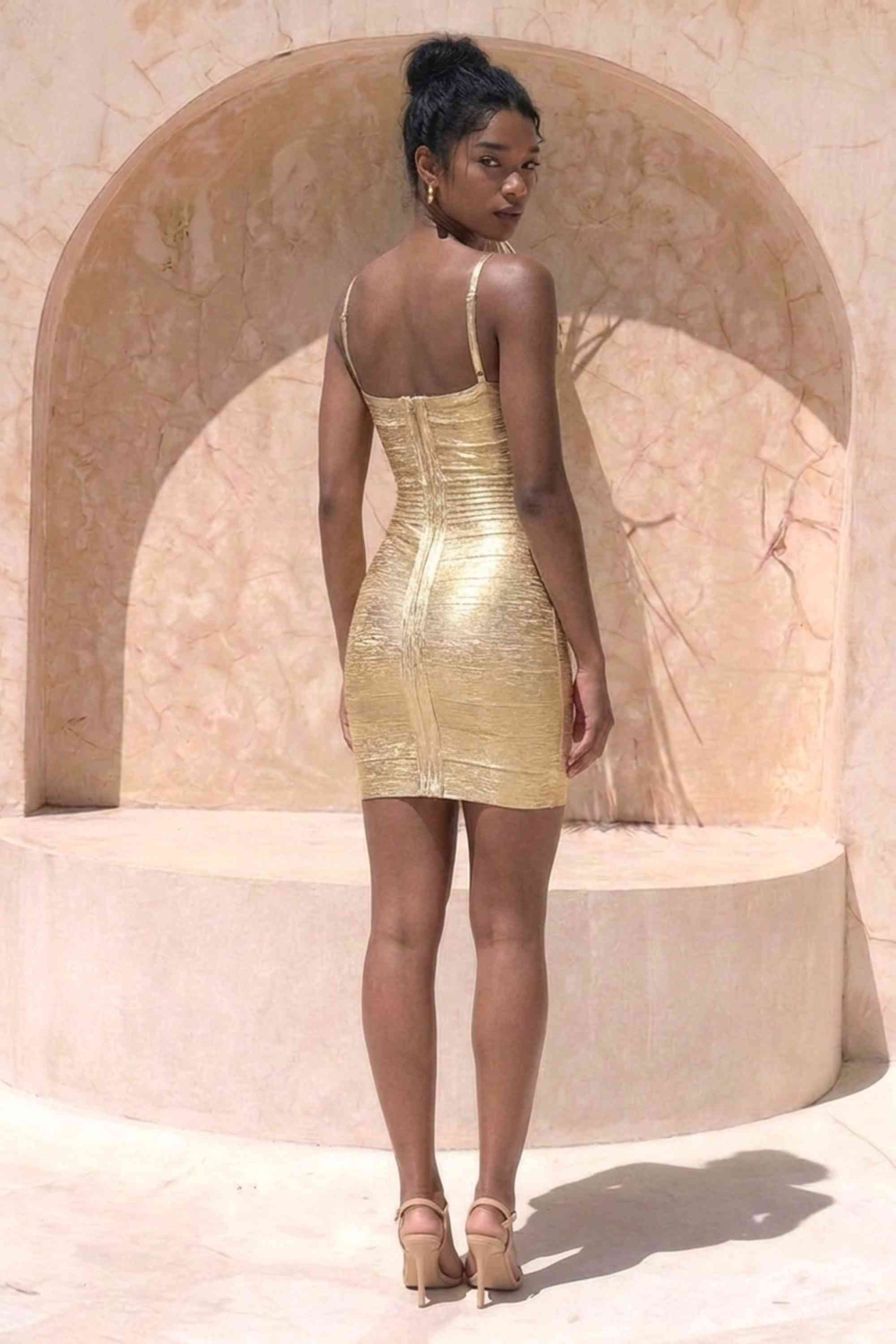 Woman wearing a figure flattering Scarlett Bandage Mini Dress - Gold BODYCON COLLECTION Pty Ltd