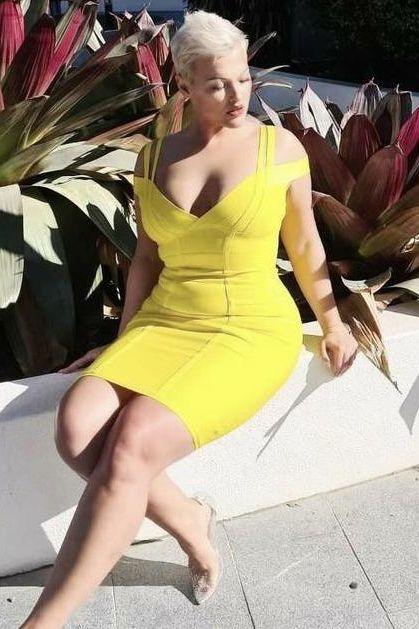 Woman wearing a figure flattering Sia Bandage Dress - Ballet Pink Bodycon Collection