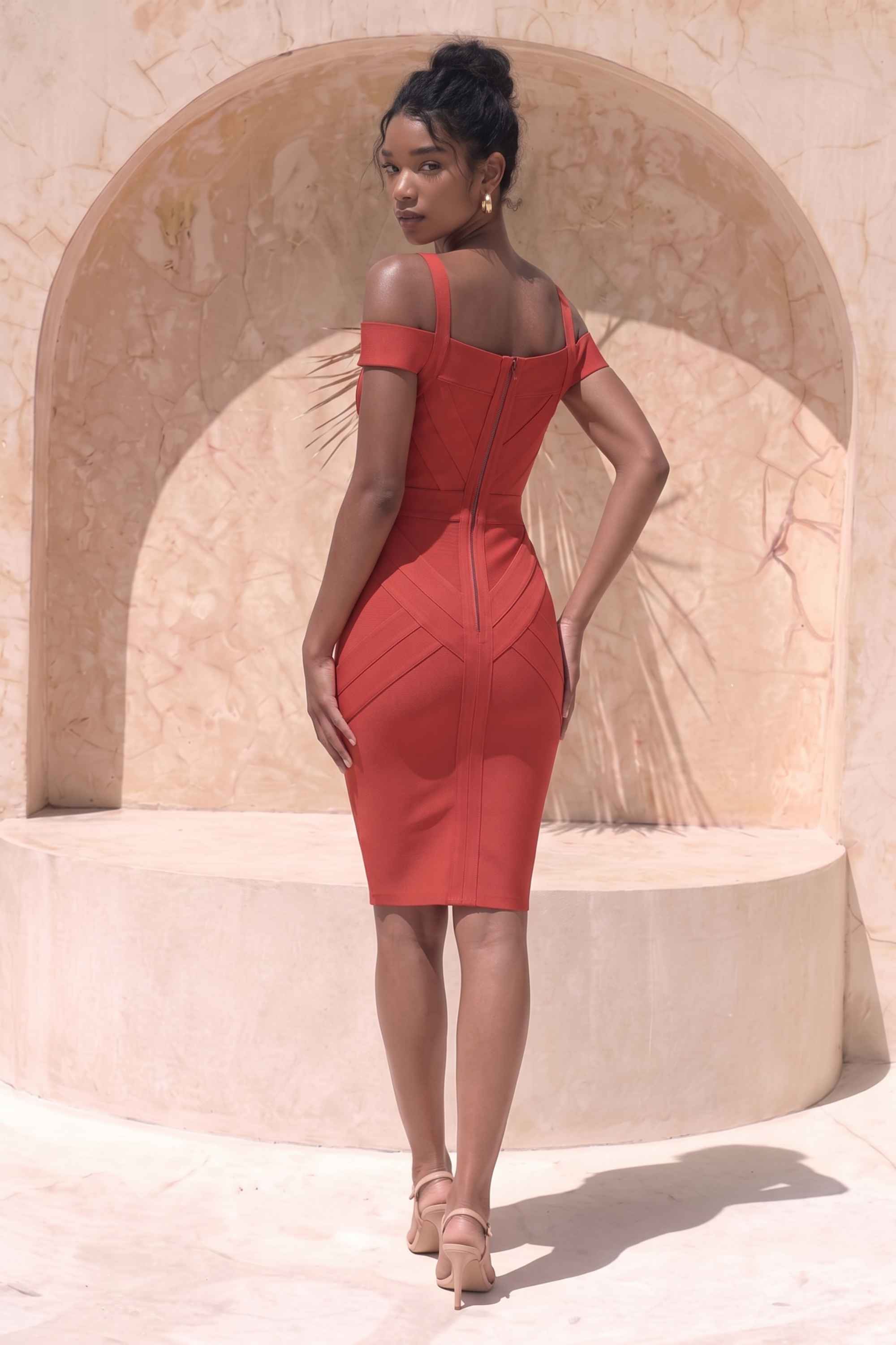 Woman wearing a figure flattering Sophia Bandage Dress - Lipstick Red Bodycon Collection