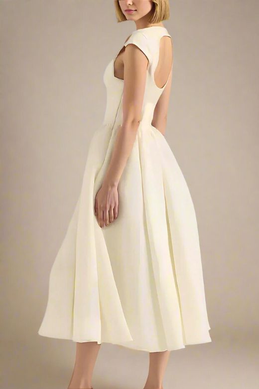 Woman wearing a figure flattering Stella Bodycon Midi Dress - Ivory White BODYCON COLLECTION