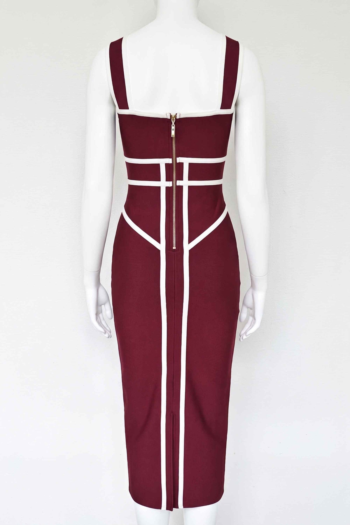 Woman wearing a figure flattering Suki Bandage Midi Dress - Red Wine BODYCON COLLECTION