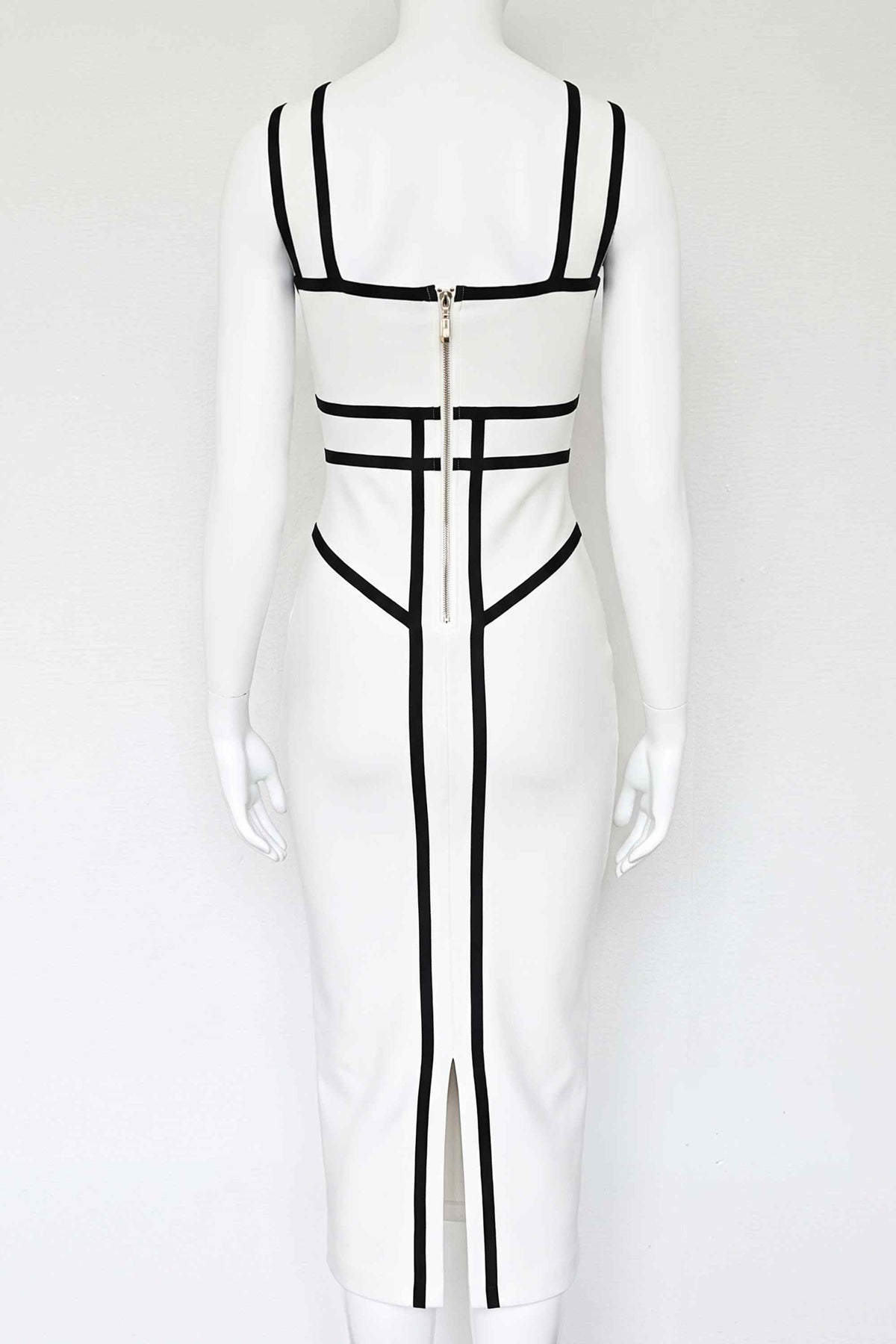 Woman wearing a figure flattering Suki Bandage Midi Dress - White Pearl BODYCON COLLECTION