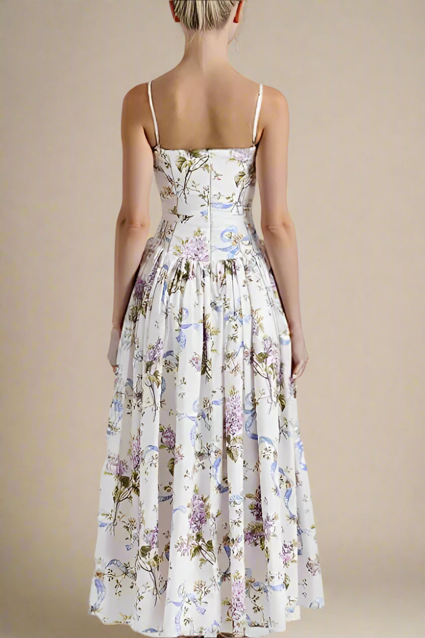 Woman wearing a figure flattering Tasmin Bodycon Midi Dress - White Floral BODYCON COLLECTION