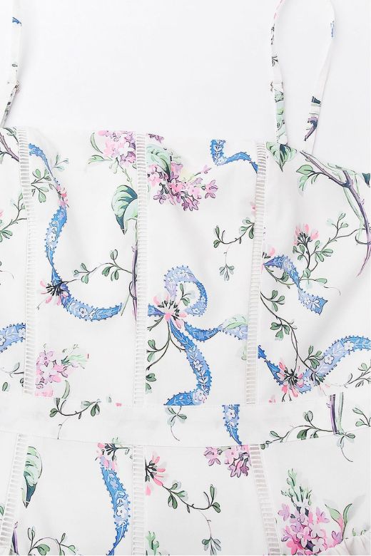 Woman wearing a figure flattering Tasmin Bodycon Midi Dress - White Floral BODYCON COLLECTION