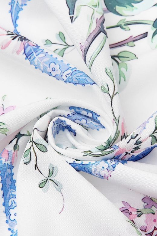 Woman wearing a figure flattering Tasmin Bodycon Midi Dress - White Floral BODYCON COLLECTION