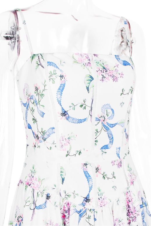 Woman wearing a figure flattering Tasmin Bodycon Midi Dress - White Floral BODYCON COLLECTION